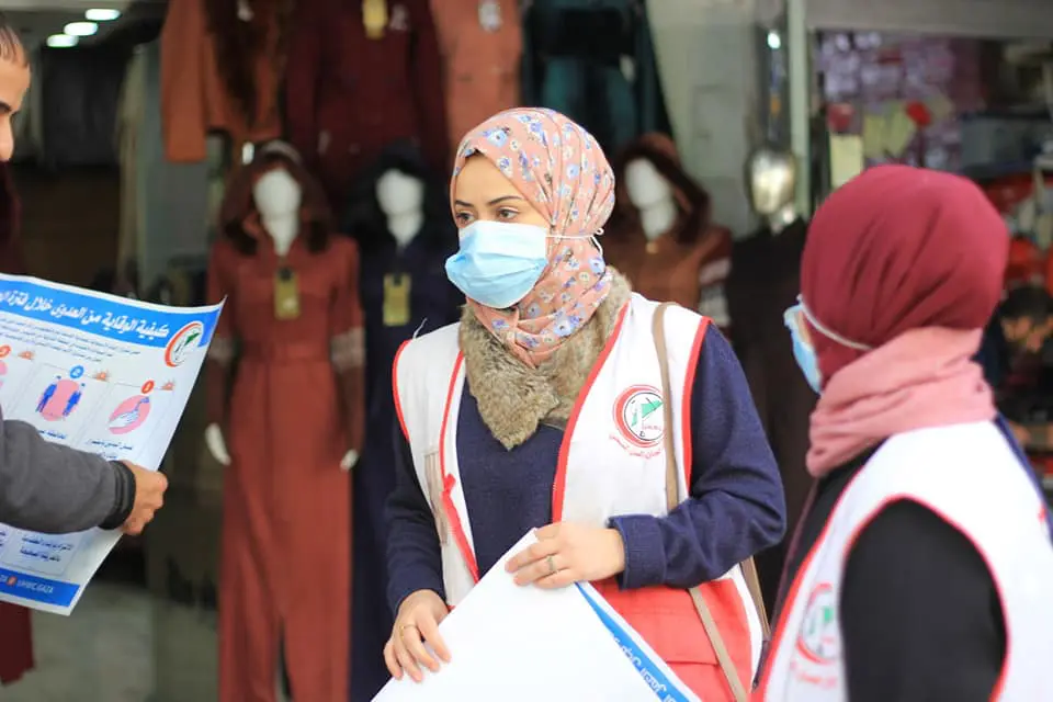 Volunteers raising awareness against covid in Gaza